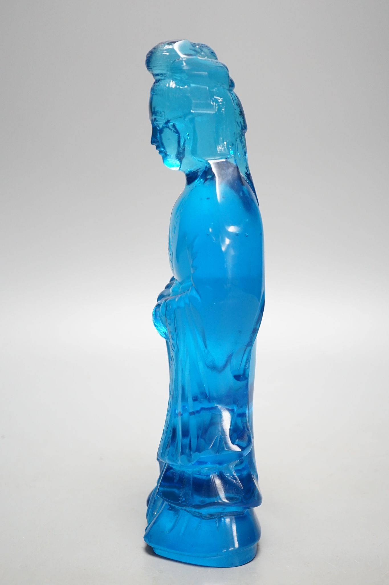 A Chinese blue glass figure of Guanyin 27cm